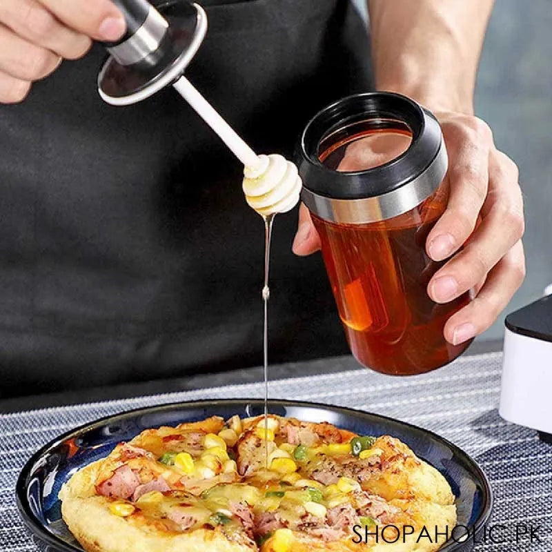 glass storage jar with honey stick image2